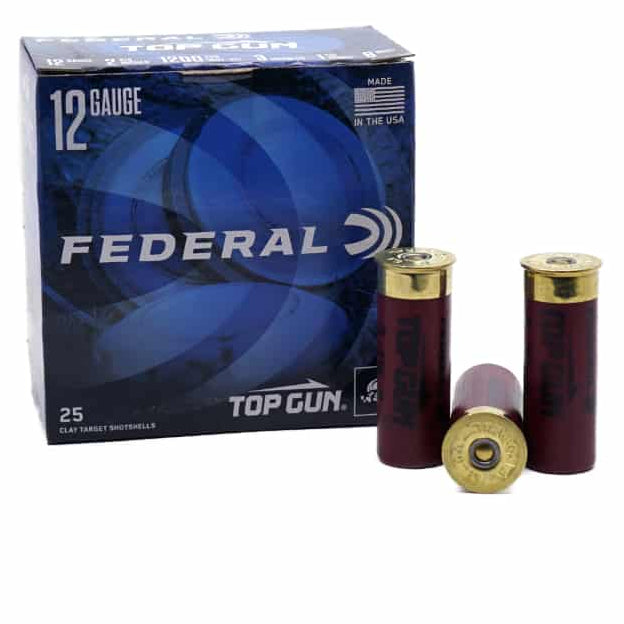 A box of Federal Top Gun 12 Gauge ammunition with visible rounds in front of the box. The packaging is primarily blue and the rounds have a red and gold color scheme.