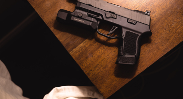 pistol on a desk.